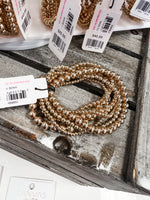 Caroline's Gold Bracelet Stack